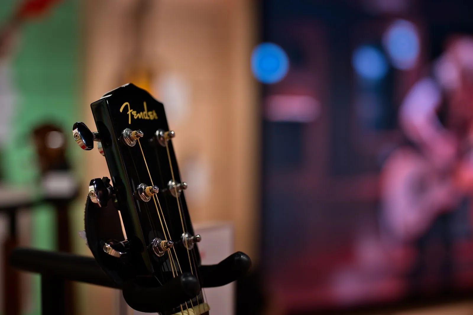 Detailed view of a Fender guitar headstock displayed indoors, Tokyo, Japan.
